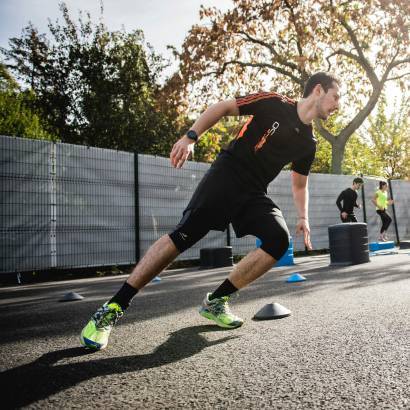 Athlete training in fitted active wear tee and shorts